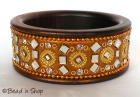 Golden Colored Bangle Studded with Mirrors & Accessories