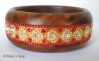 Bangle Studded with Metal Accessories & Red Rhinestones